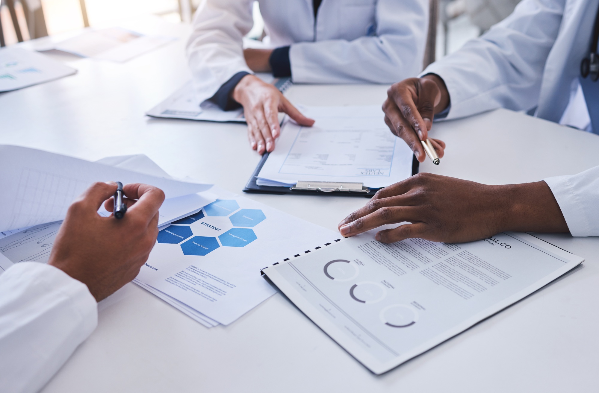 Strategy, KPI and business meeting with people hands, document, paperwork and marketing research ch
